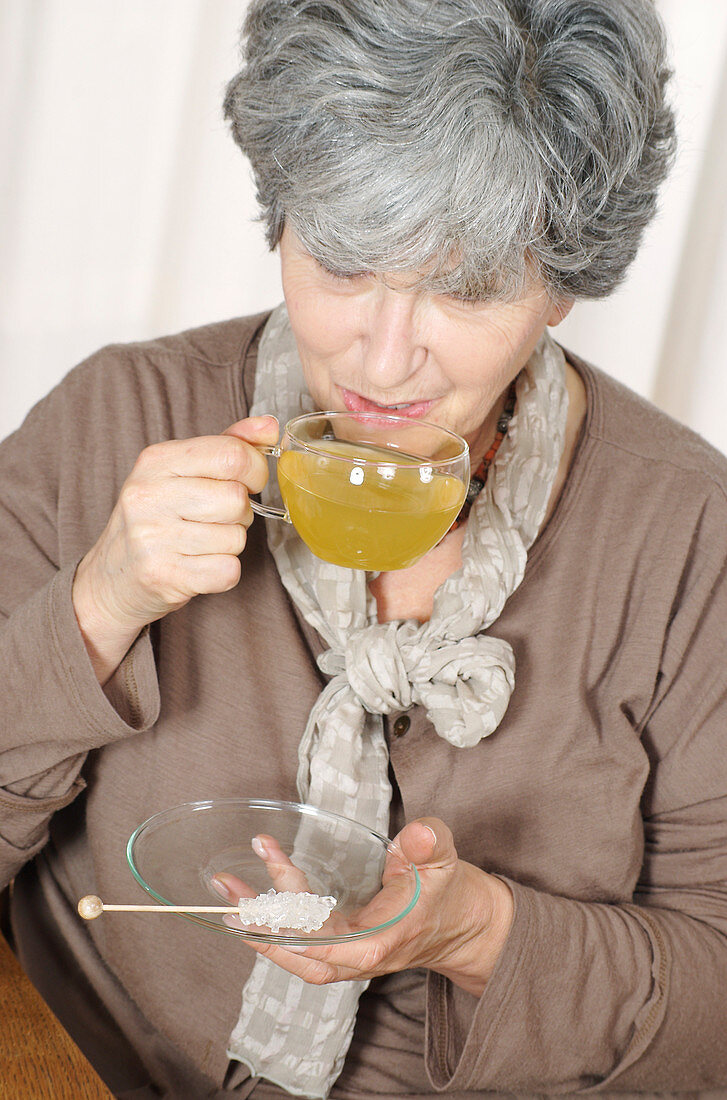 Woman drinking herb tea