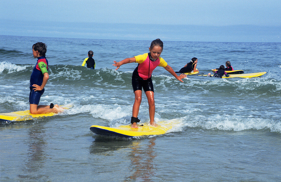 Children playing on surfboards