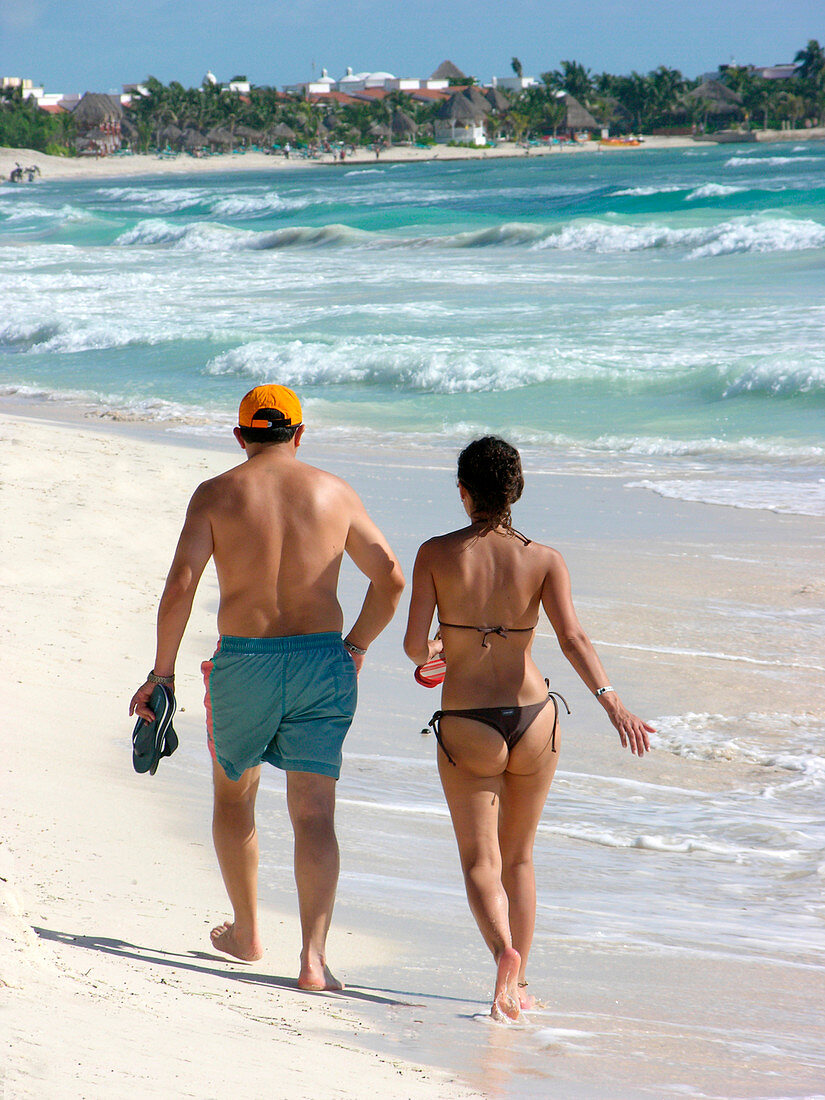 People walking along a beach