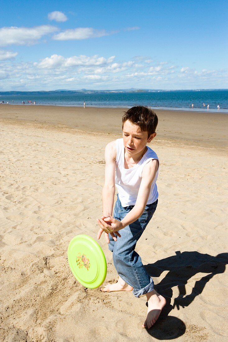 Boy catching a frisbee