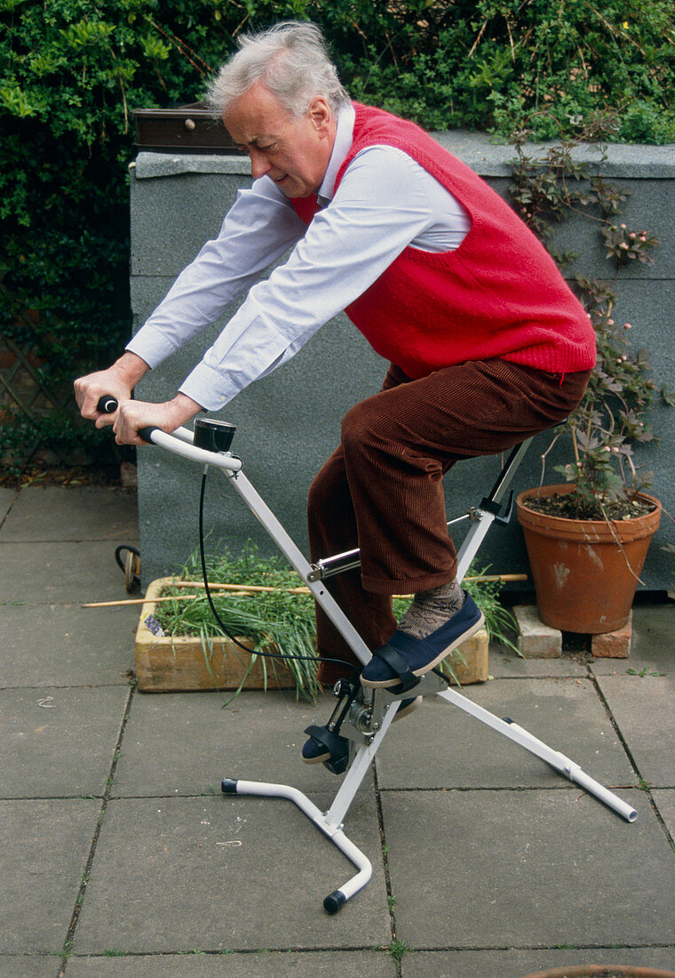 A man using an exercise bicycle