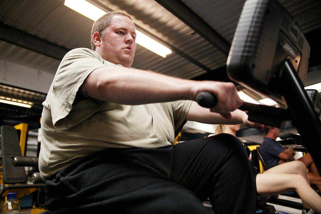 Obese man exercising
