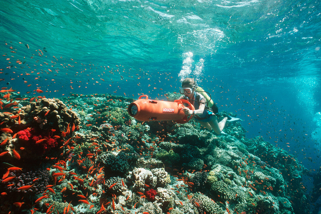 Scuba diver using a DPV