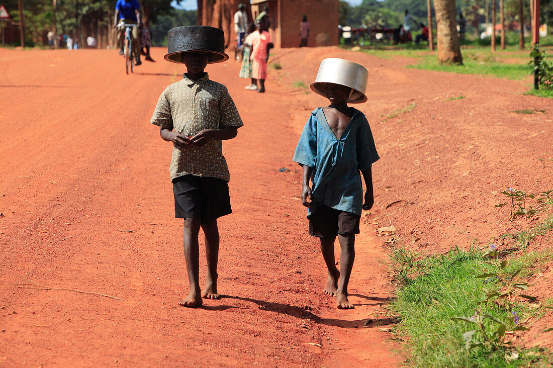 Children with water bowls,Uganda