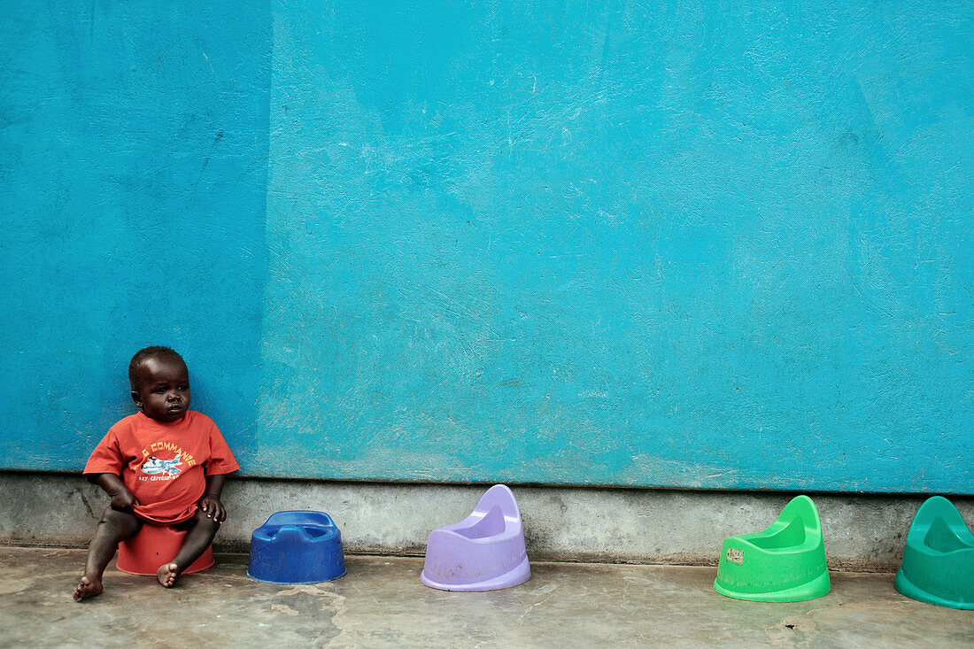 Ugandan child on a potty