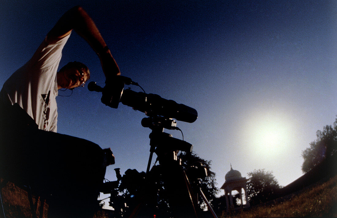 Amateur astronomer observing a solar eclipse