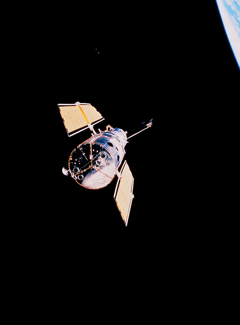 HST in flight after servicing,STS-61