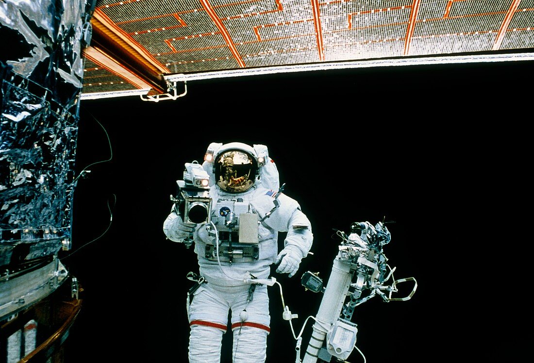Astronaut spacewalks to repair Hubble telescope