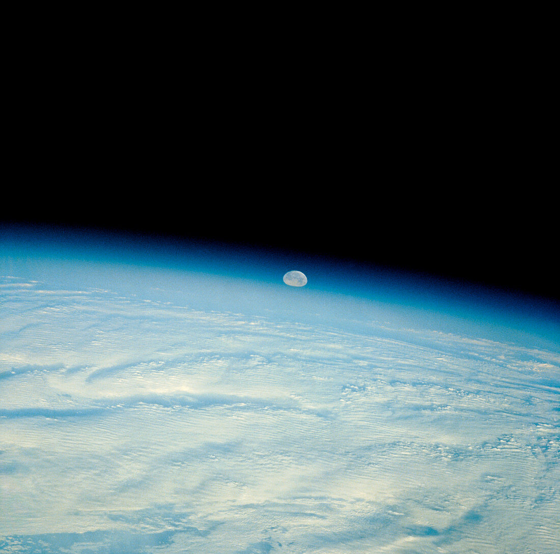 Shuttle photograph of the moon over the earth