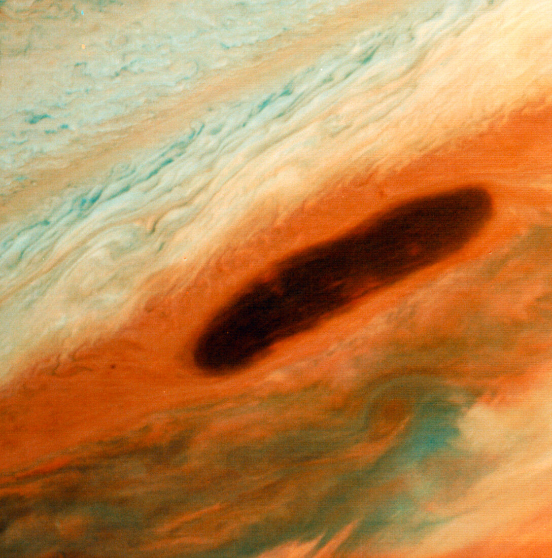 Voyager 1 image of a brown oval feature on Jupiter