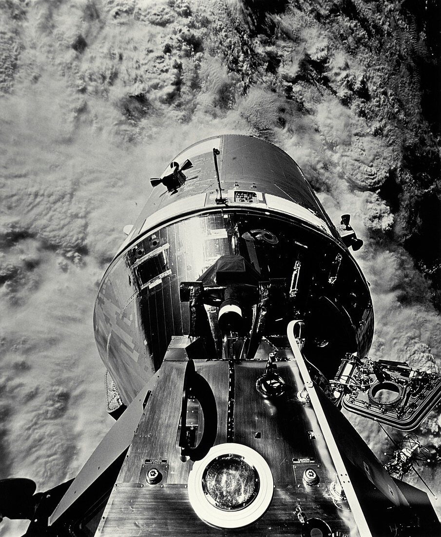 Apollo 9 docked command module above earth