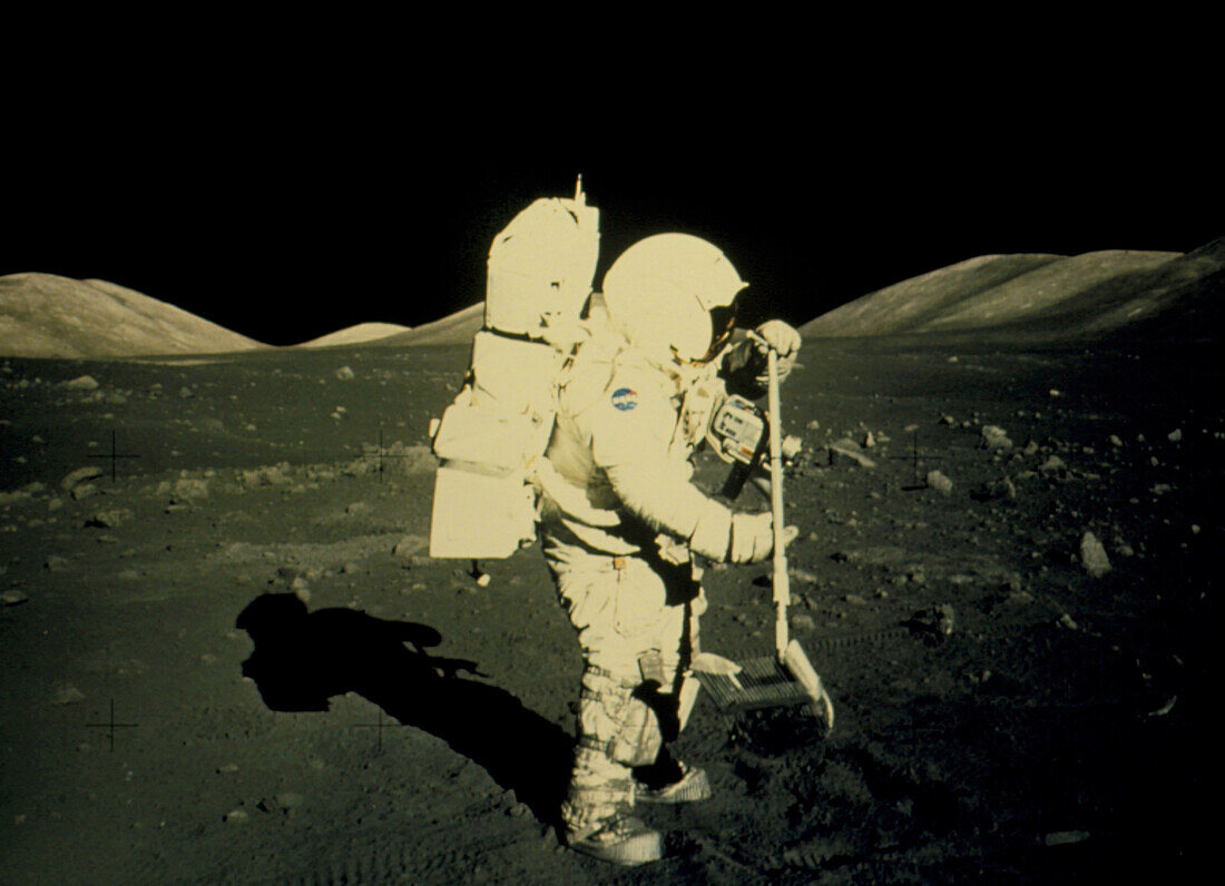 Apollo 17 astronaut collecting lunar rock samples