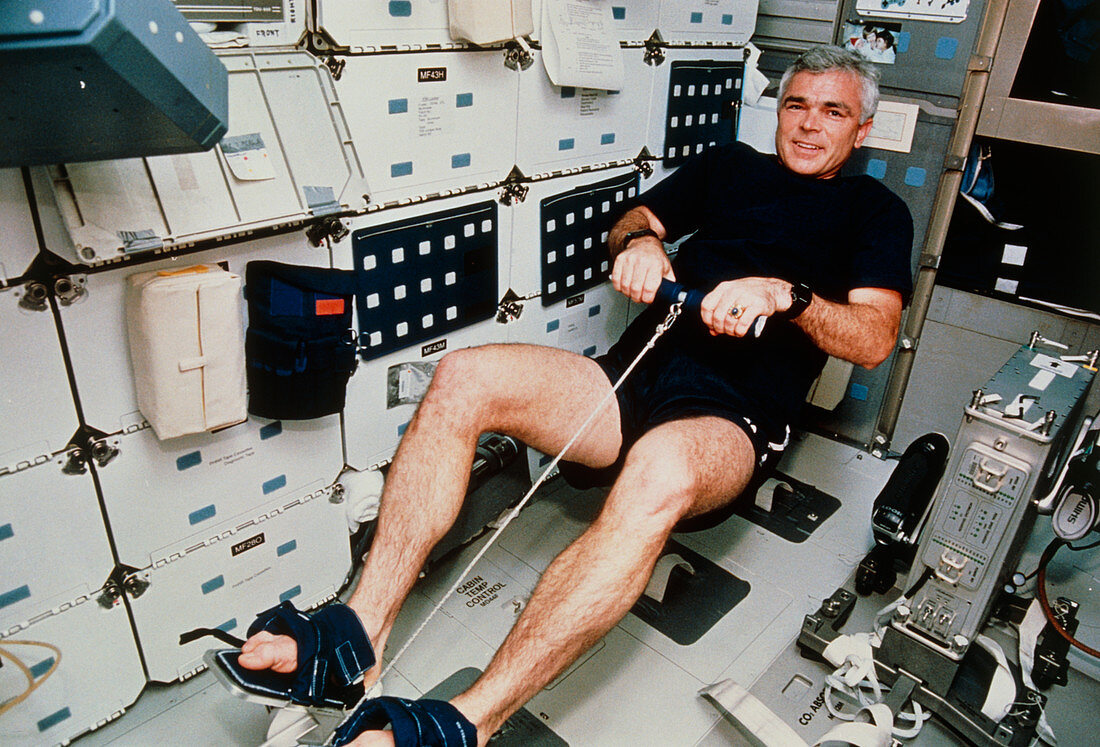 Astronaut Clifford using rowing machine,STS-59