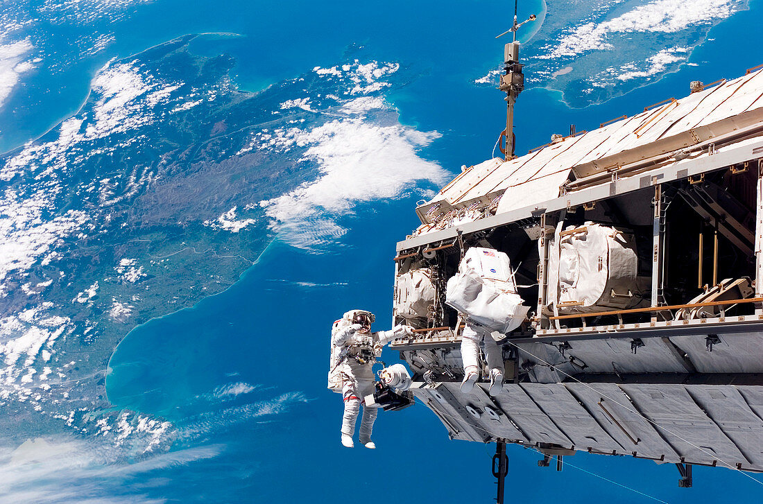 Astronauts performing spacewalk