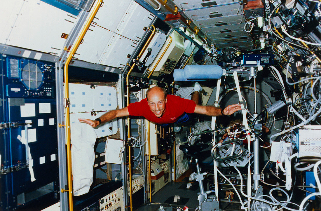 Astronaut James Bagian floating in SLS-1 lab