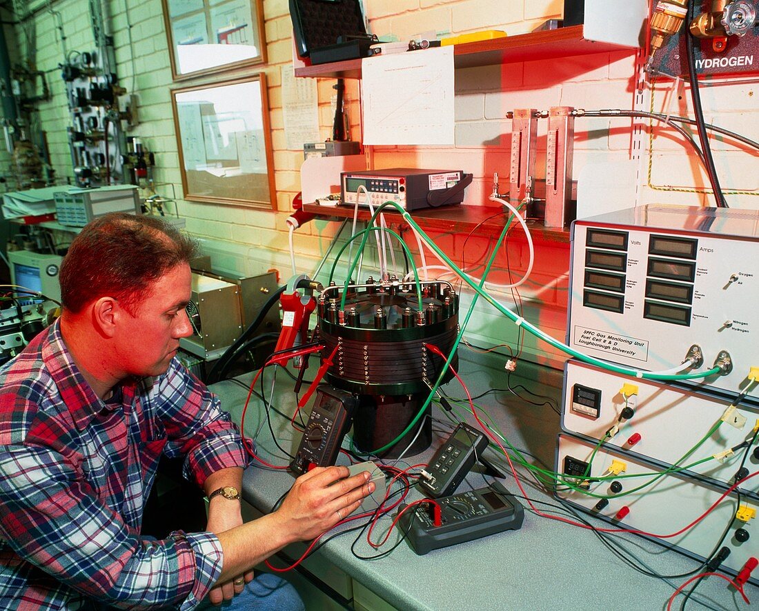 A technician testing a solid polymer fuel cell