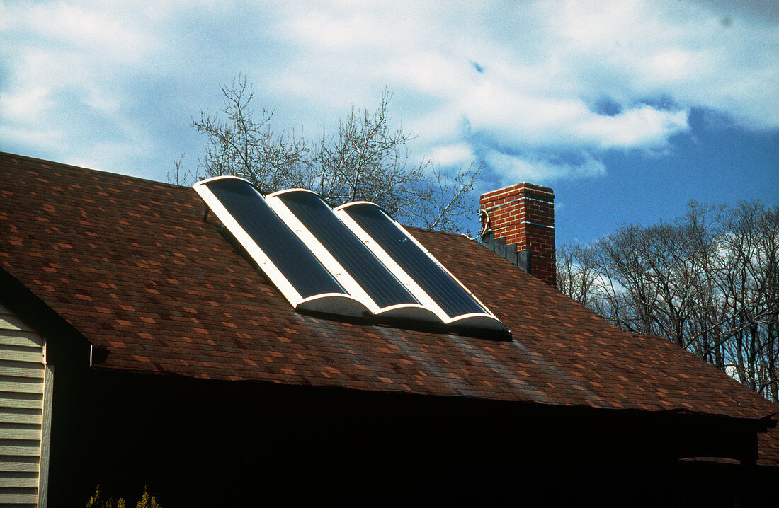 Solar panels for water heating on roof of house