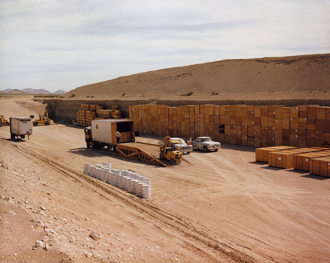 Drums of nuclear waste being stored in a trench