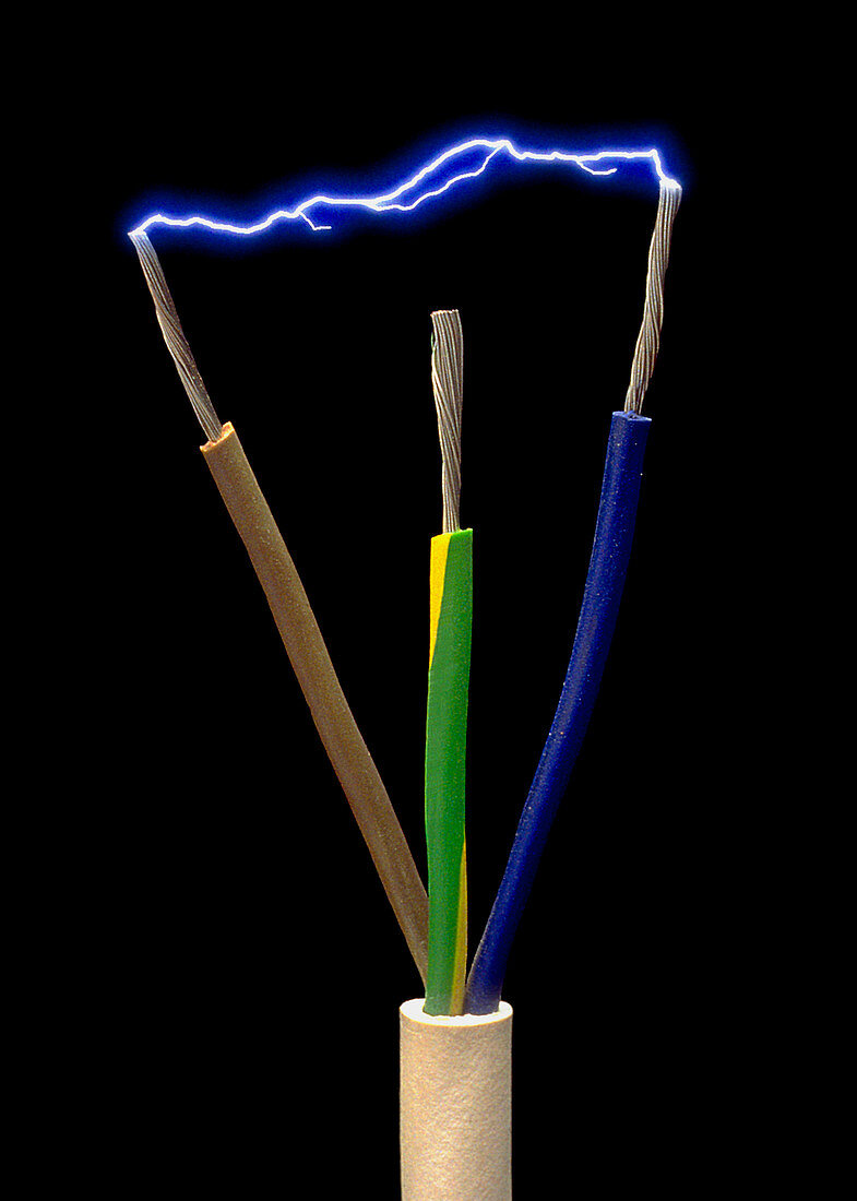 Wires of a 3-pin plug showing spark discharge