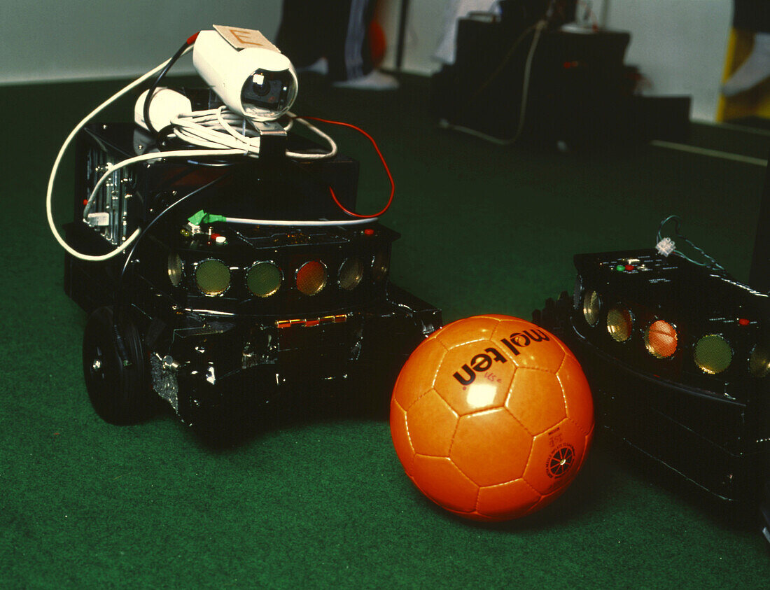 Two robots go for a ball at RoboCup-98 in Paris