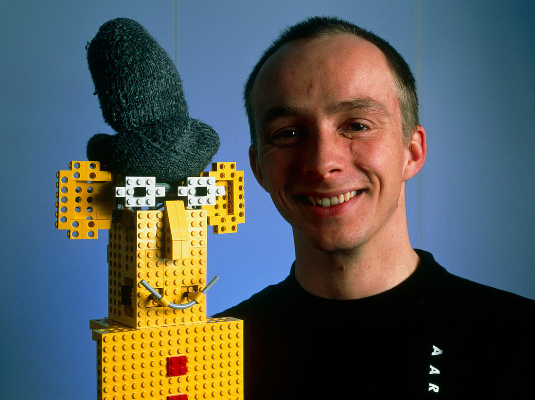 Researcher with his happy emotional Lego robot