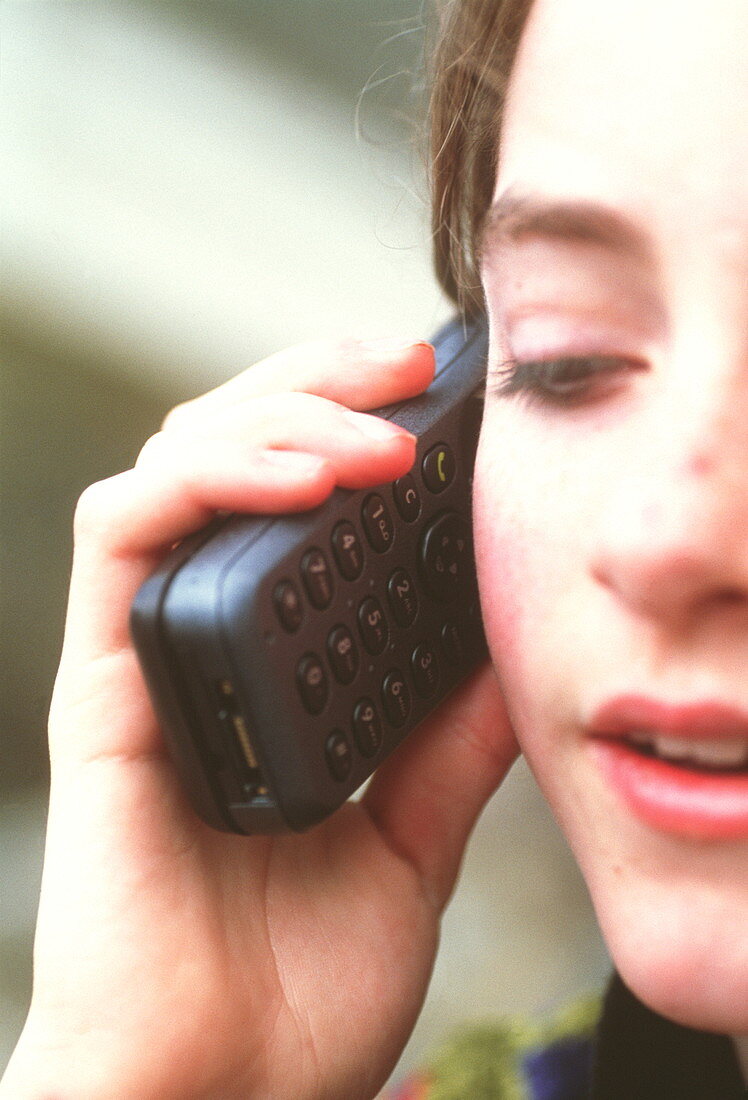 Girl using mobile telephone