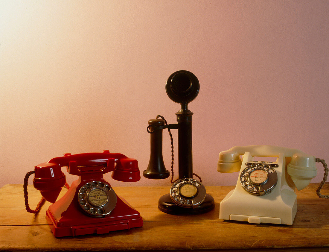 Three old Bakelite telephones