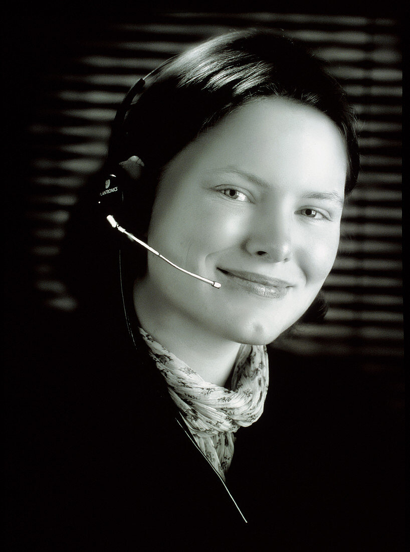 Businesswoman wearing a telephone headset