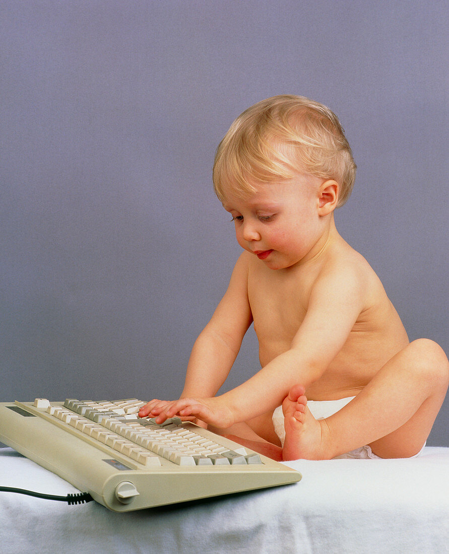 Baby with computer keyboard