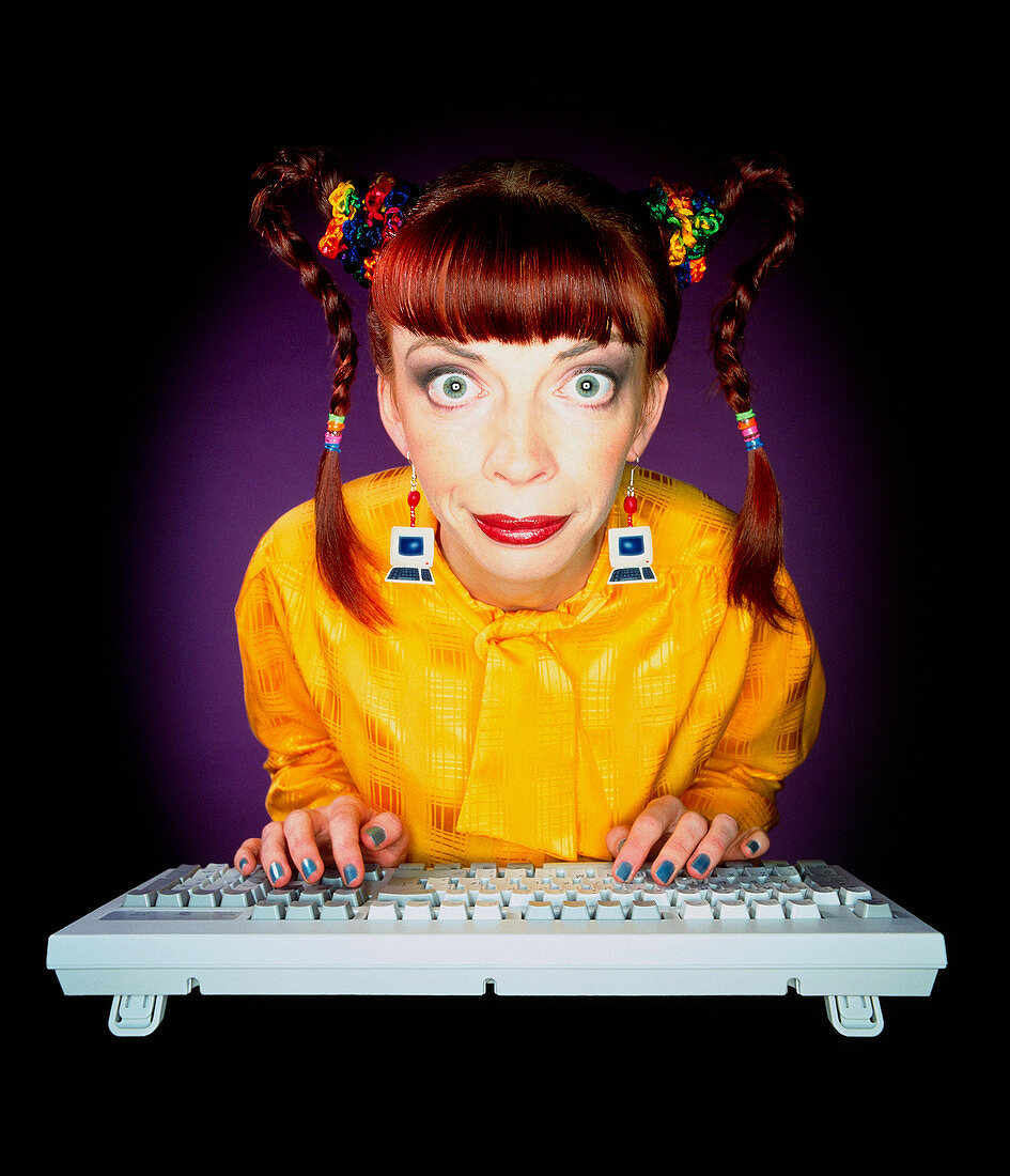 Female computer nerd working at her computer