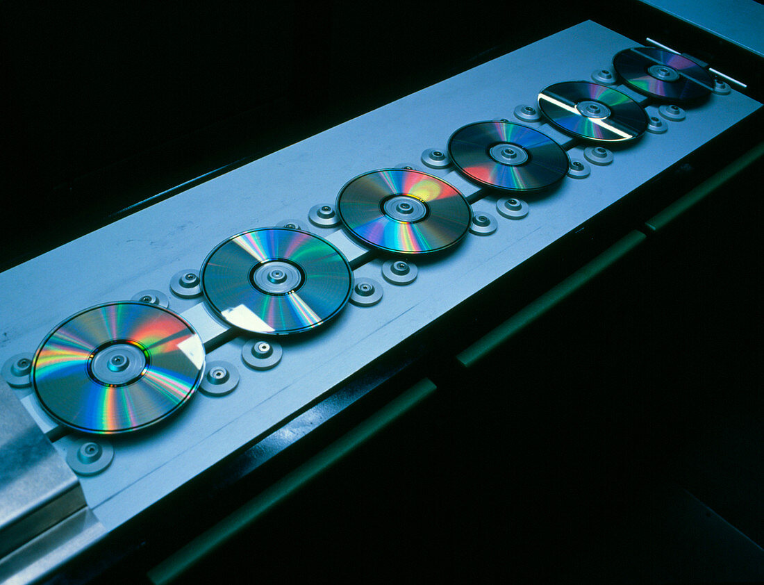 Compact discs on a production line conveyor belt