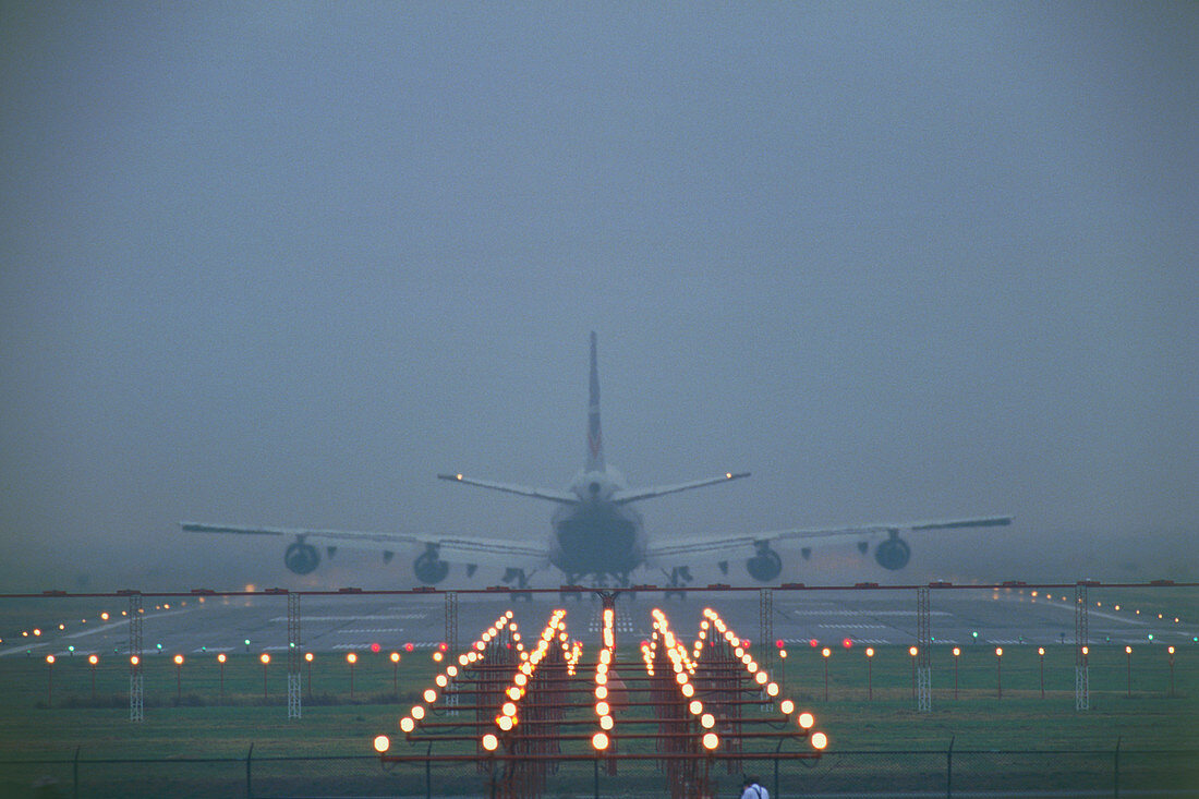 747 airliner taking off in fog,Vancouver
