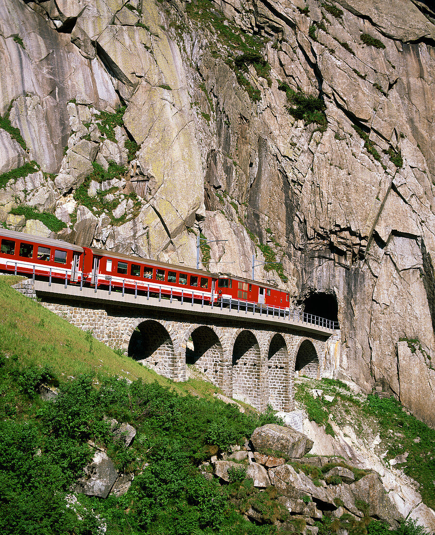Train and tunnel in a granite gorge,Switzerland
