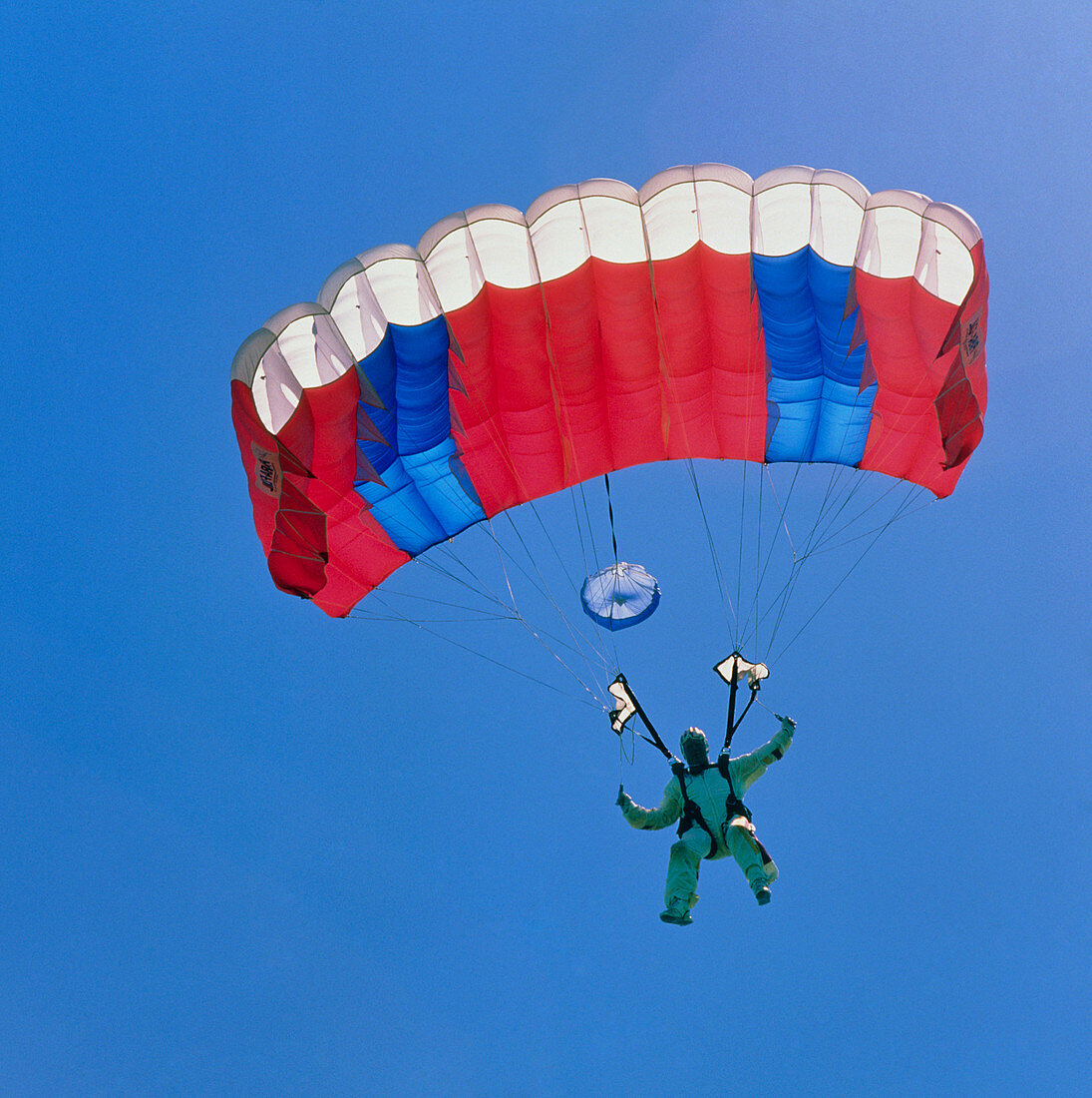 Parachutist under ram-air canopy