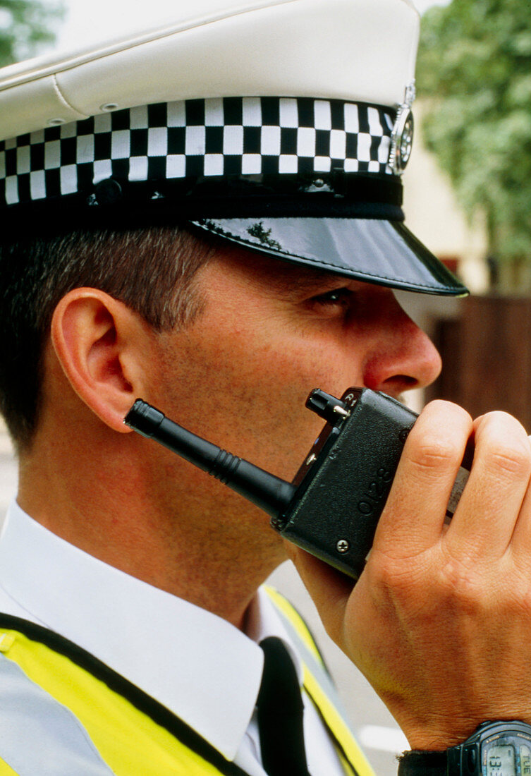 Policeman using walkie-talkie