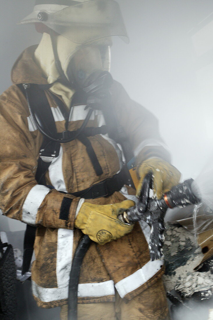 Firefighter extinguishing a fire