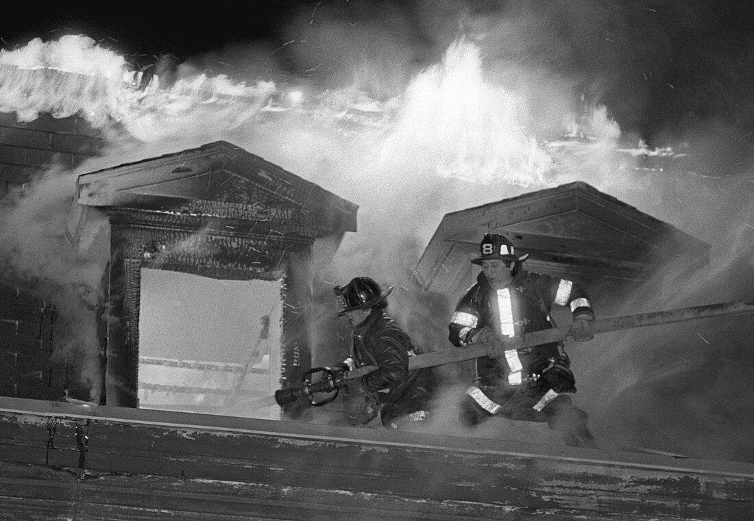 Firemen fighting a house fire