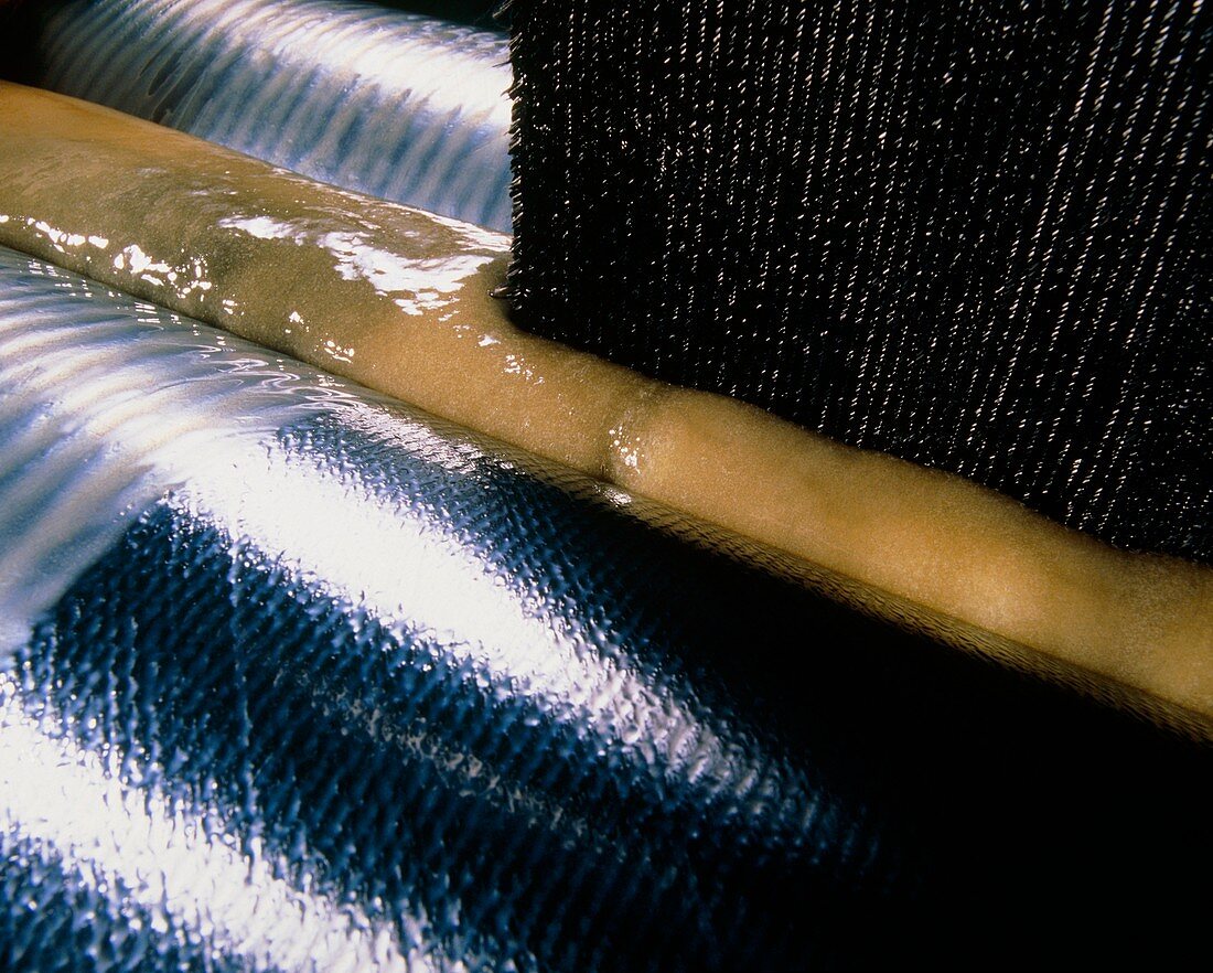 Carbon fibre fabric being impregnated with resin