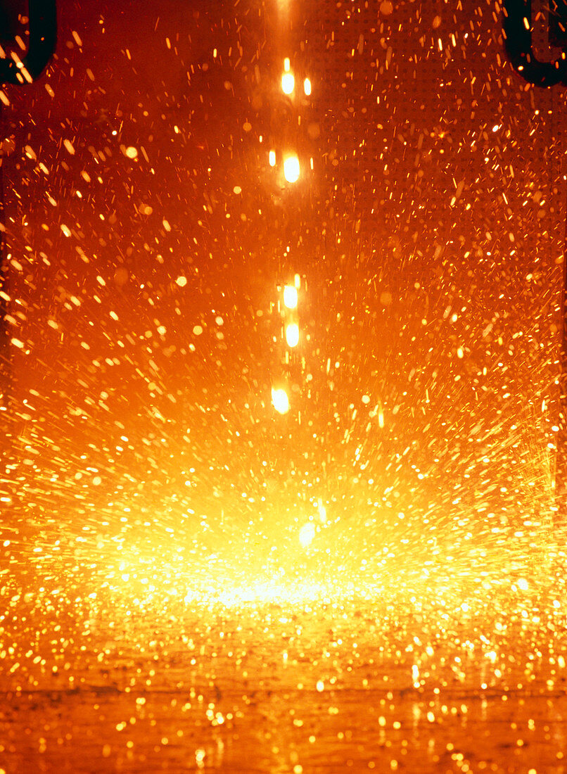Molten steel droplets falling from test plate