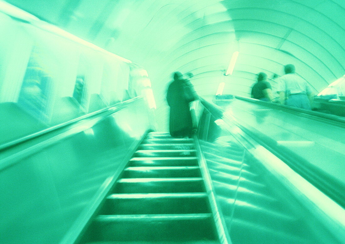 Commuters on an escalator