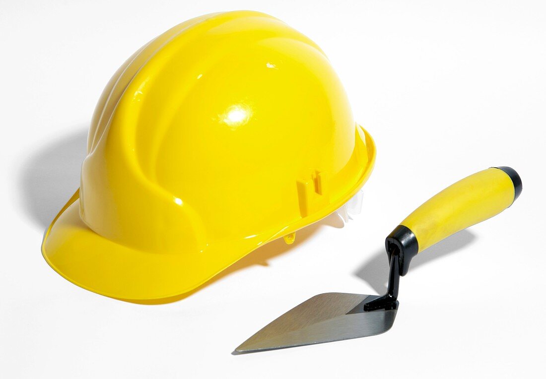 Bricklayer's hard hat and trowel