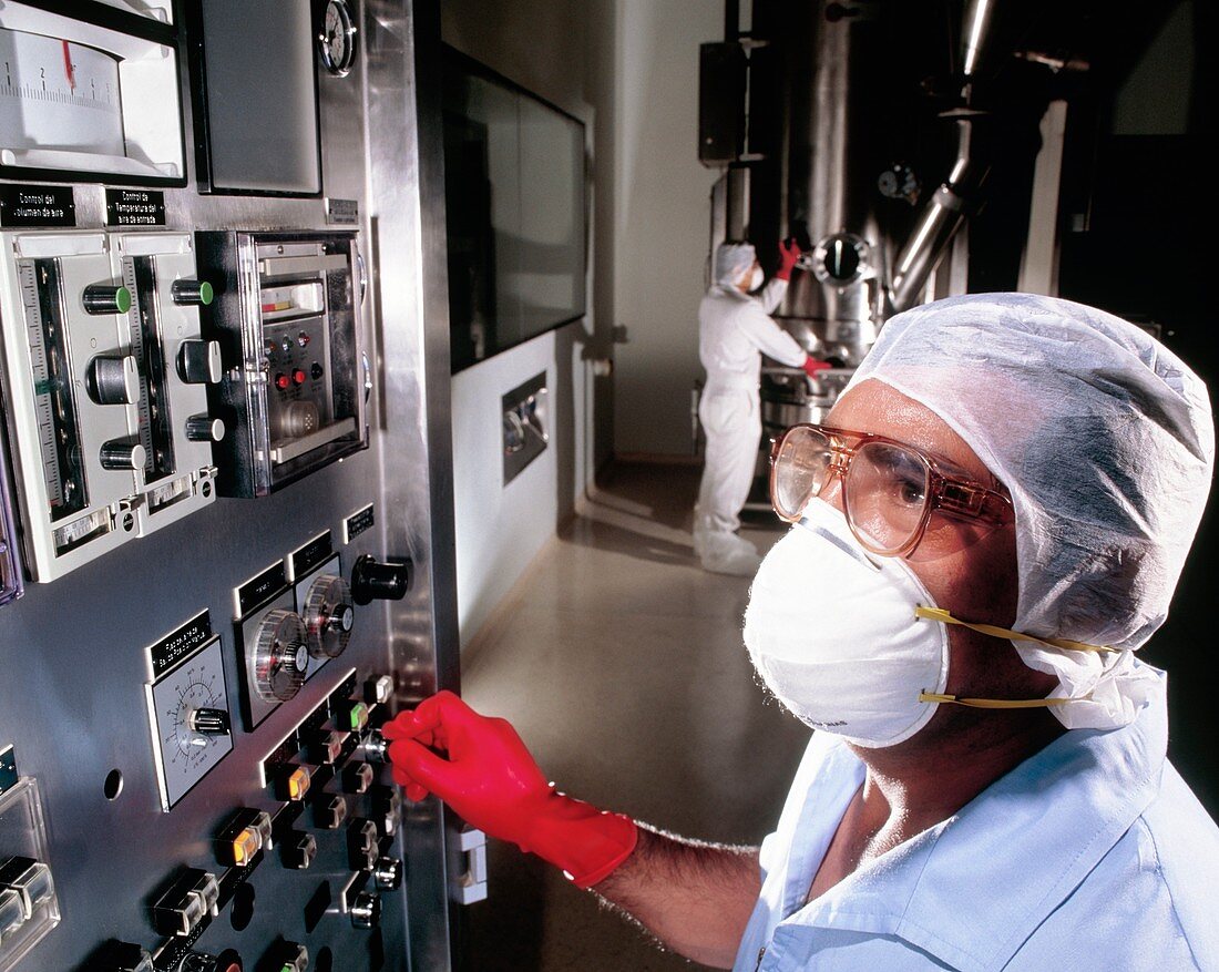 Operator at controls of dryer,drug manufacture