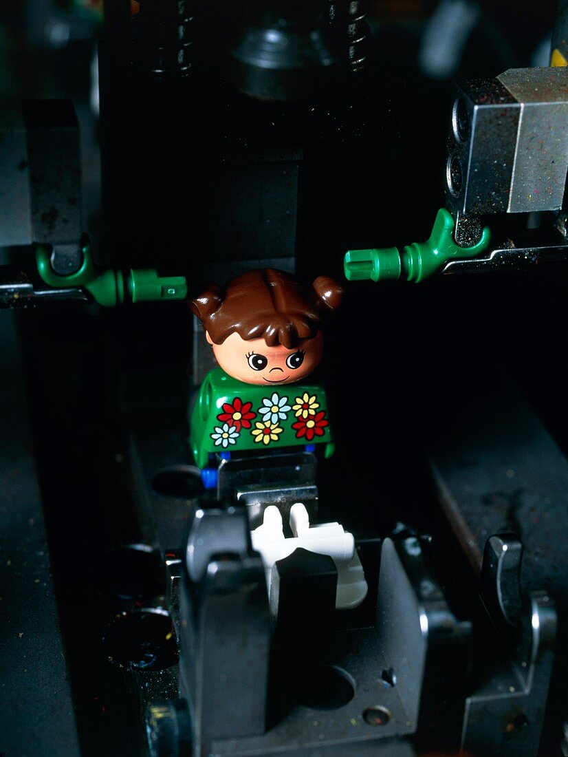 Lego doll in an assembly machine