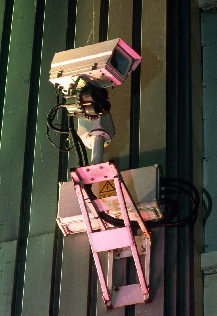 Surveillance camera mounted on a wall