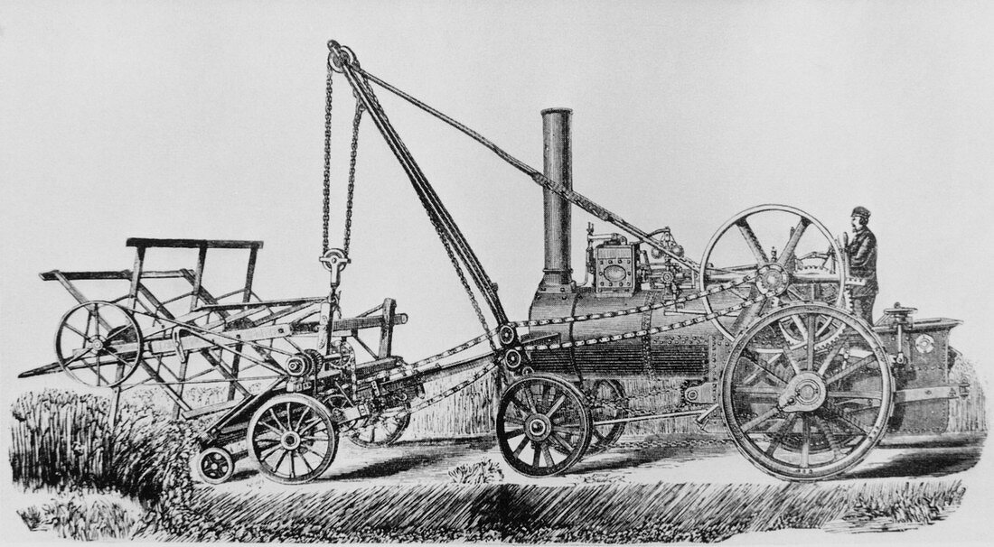 Traction engine powering a reaping machine
