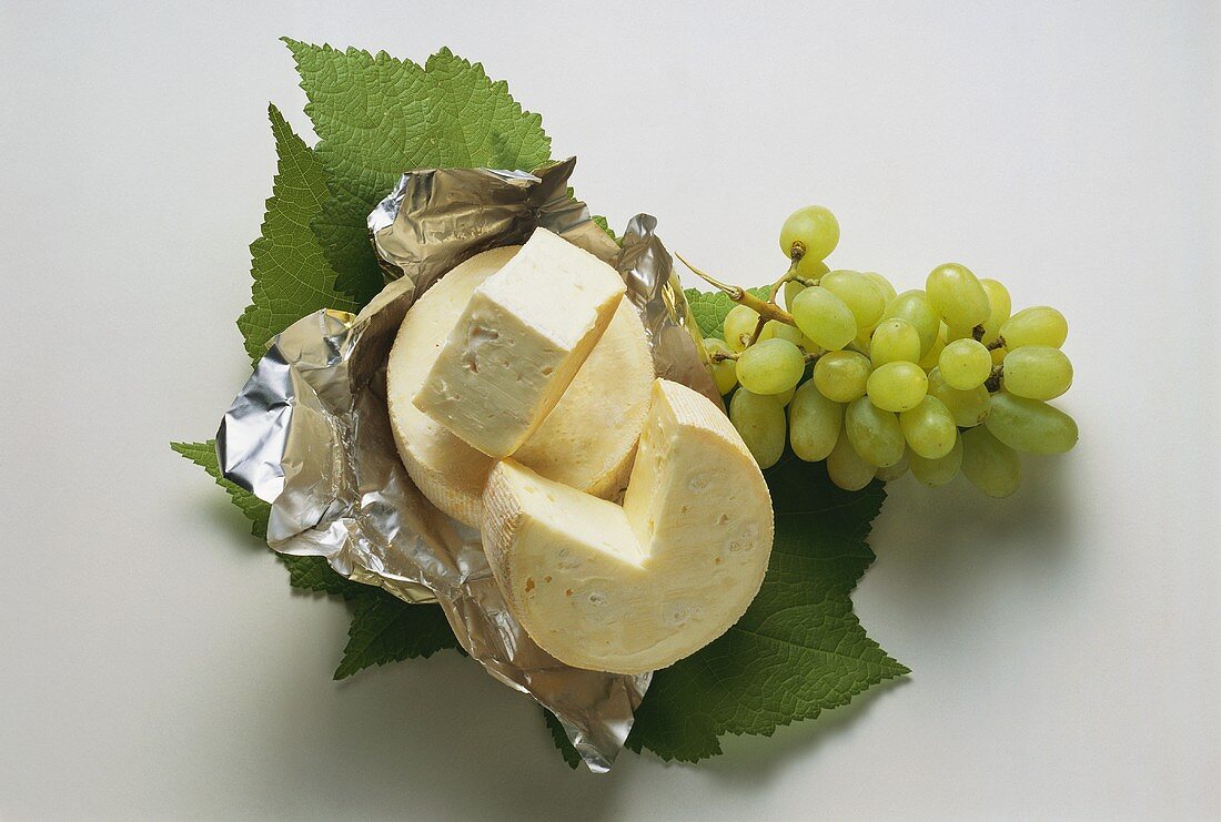 Marquis Cheese on Leaves with Grapes