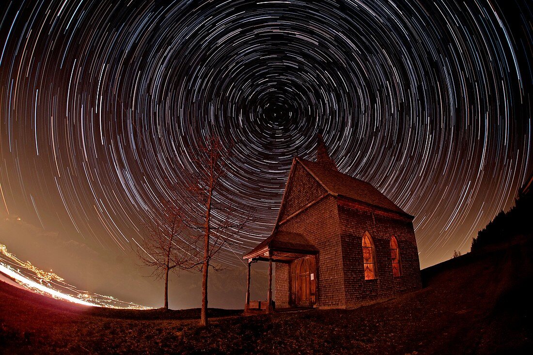 Star trails over an alpine church