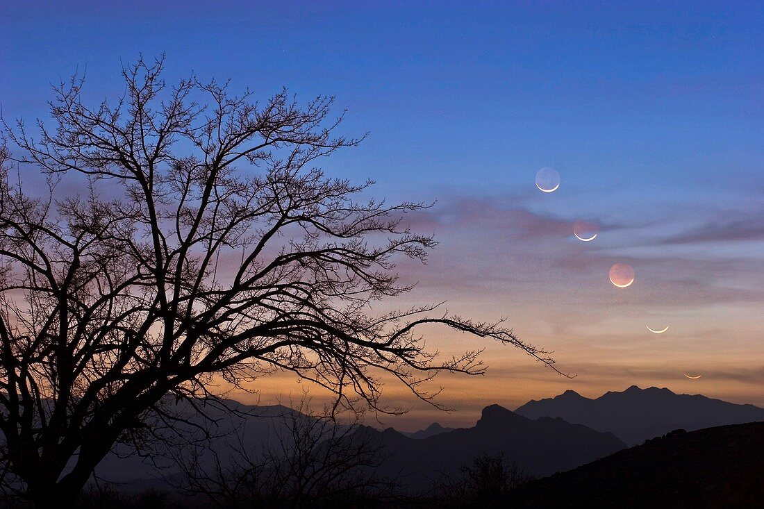 Moon setting over mountains