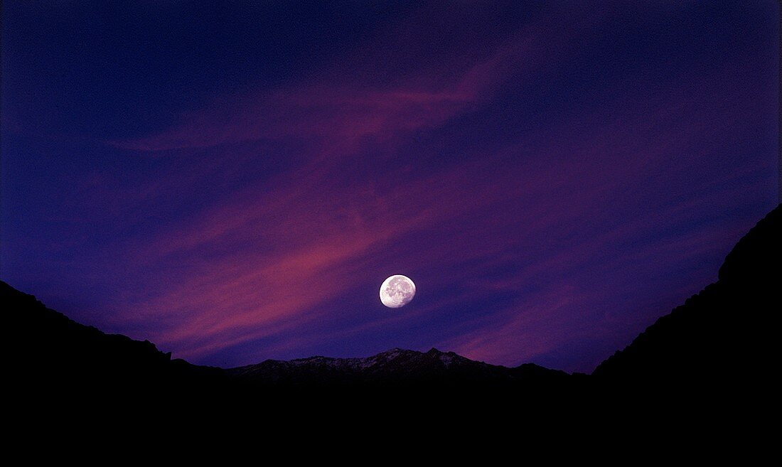 Moon and mountains at sunset