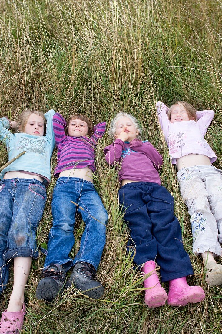 Girls lying in a meadow
